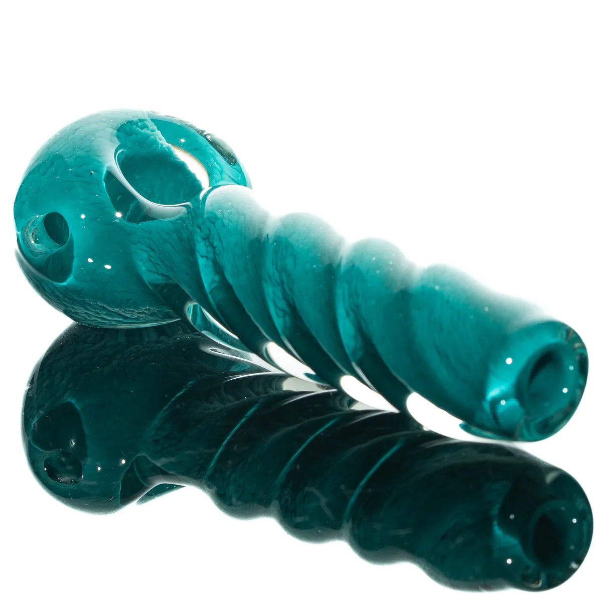 Aqua blue glass hand pipe with a twisted design and reflective base for smoking.