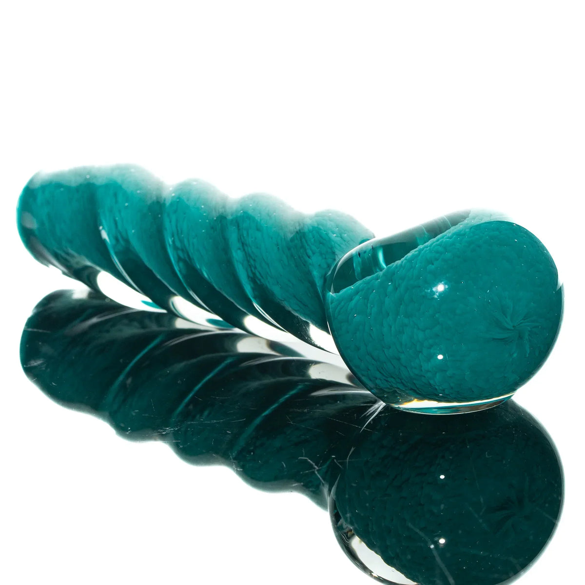 Aqua blue glass spoon pipe with a twisted frit design, displayed on a reflective surface.