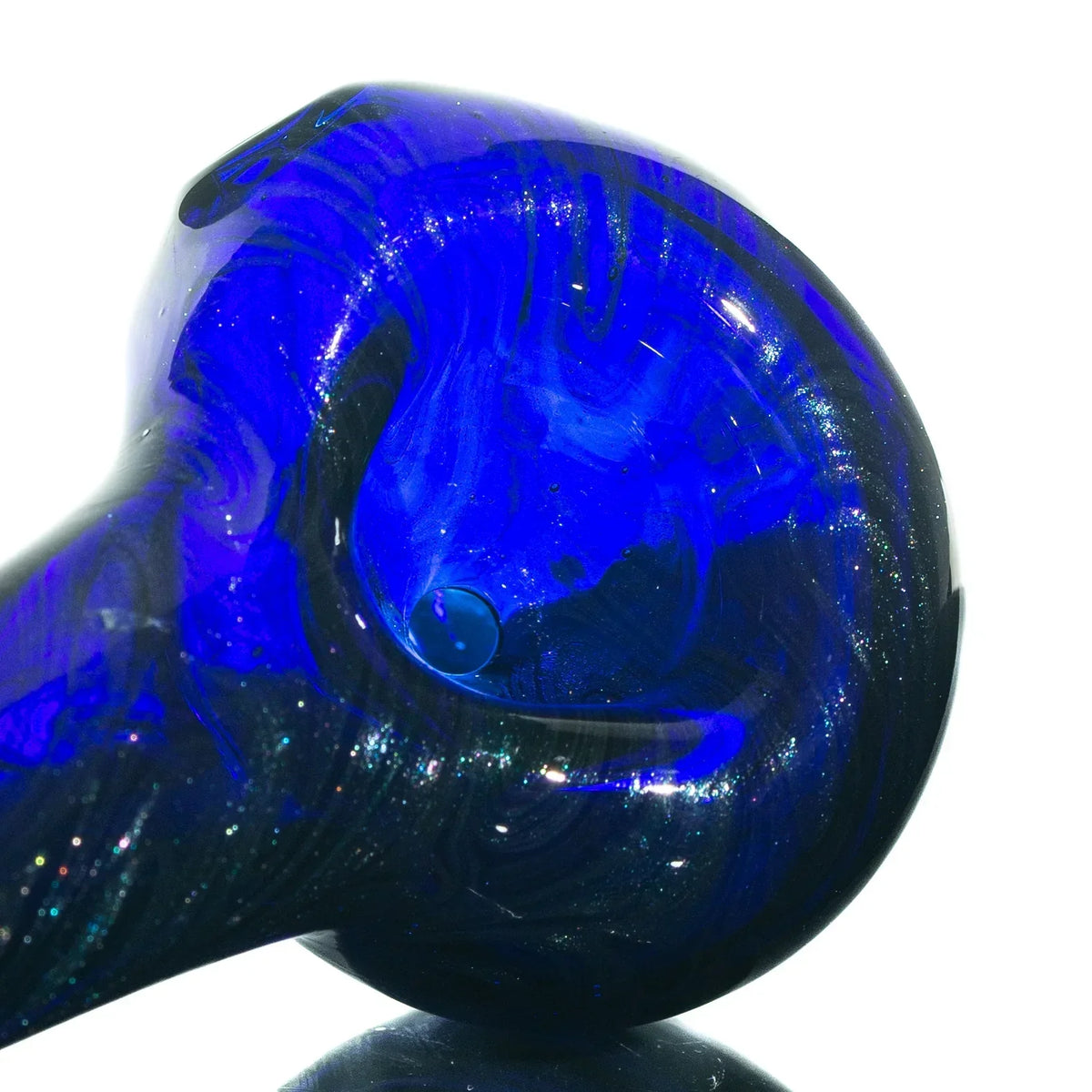 Close-up of a blue glass hand pipe with swirling patterns, isolated on white background.