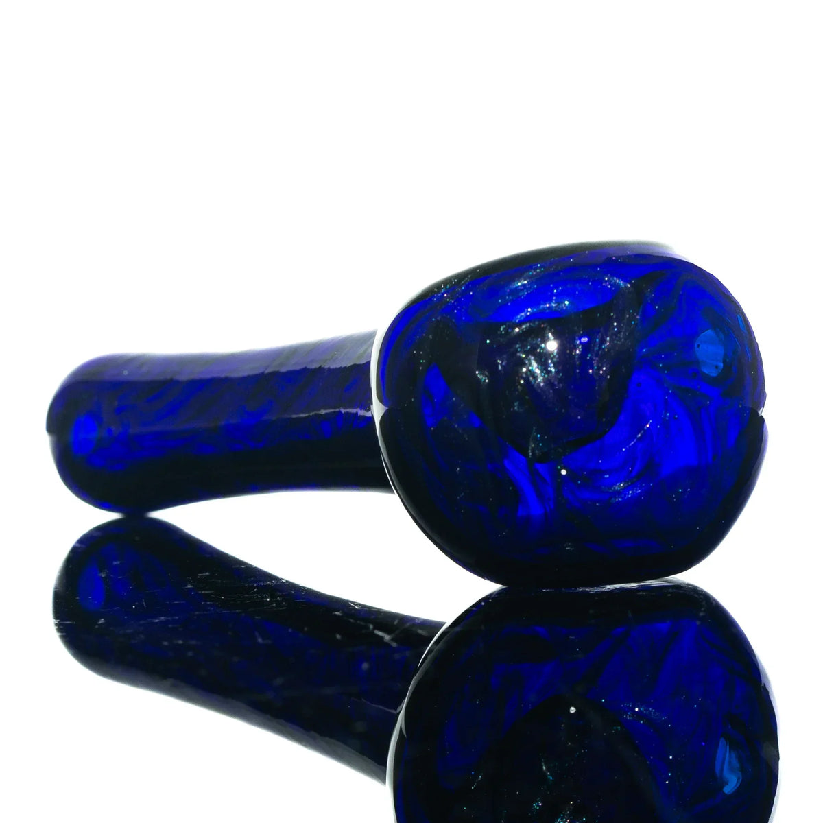 Blue glass hand pipe with swirling patterns on a reflective white background