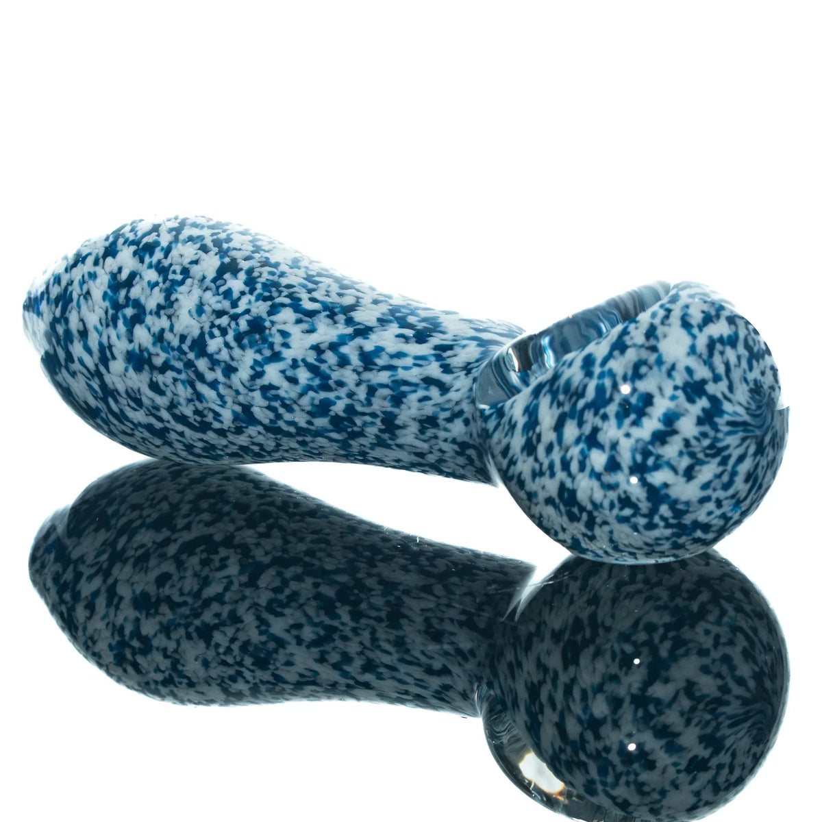 Blue and white frit glass hand pipe with speckled pattern on reflective surface