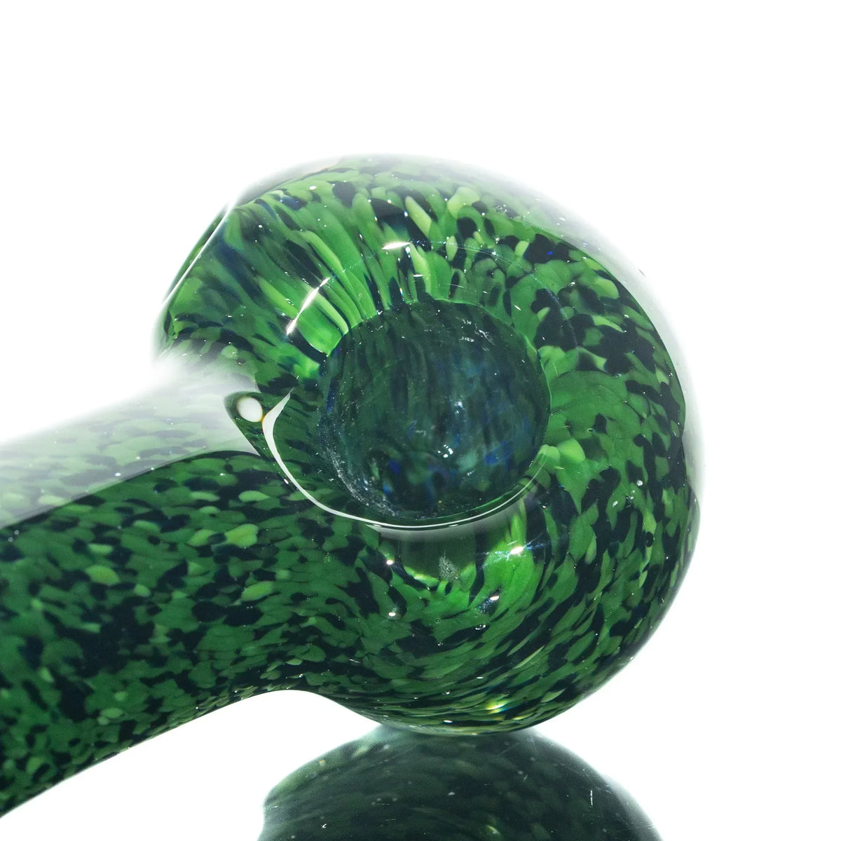 Green and black frit glass spoon pipe with a deep bowl on a white background