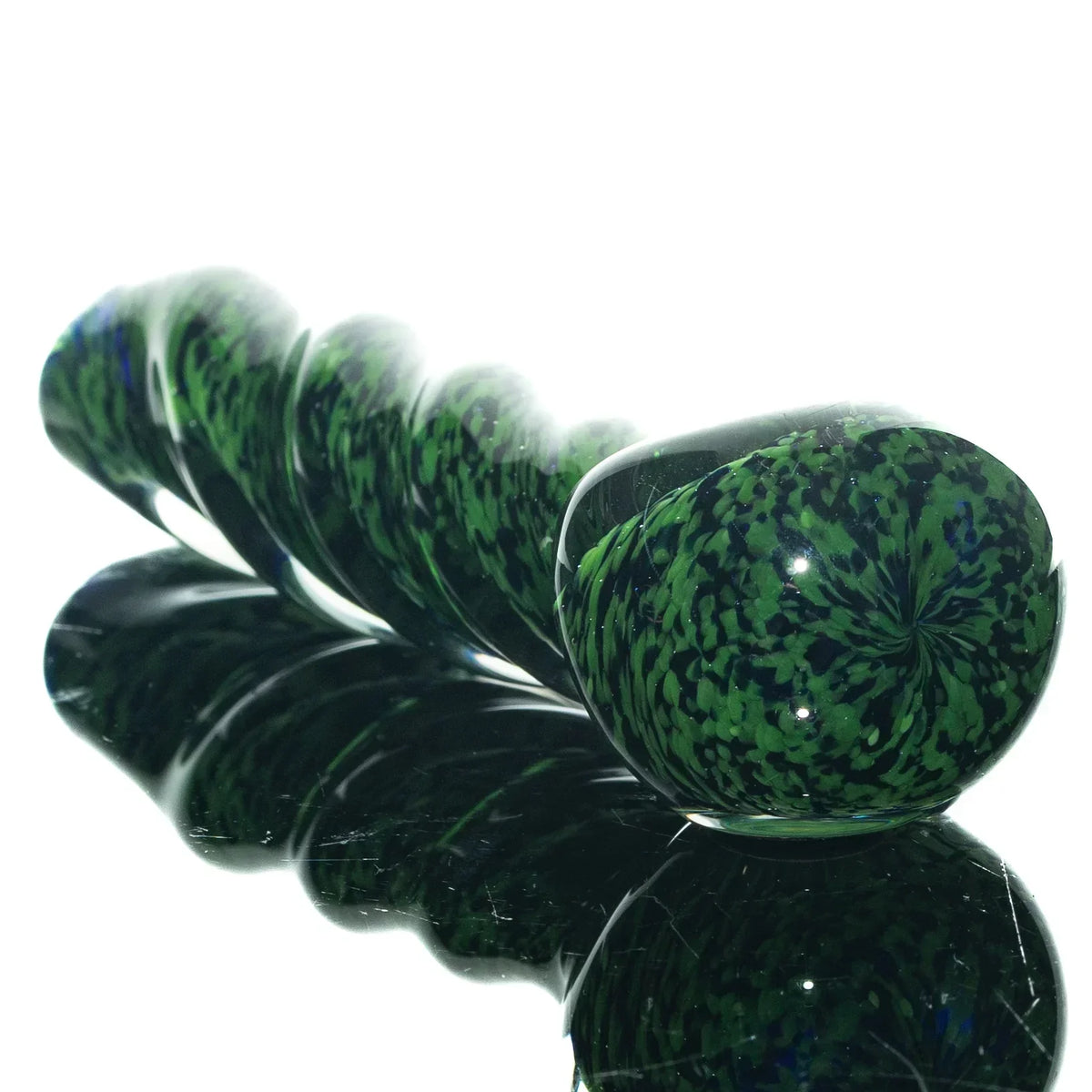 Green and black glass twist spoon pipe with fritted pattern on reflective surface