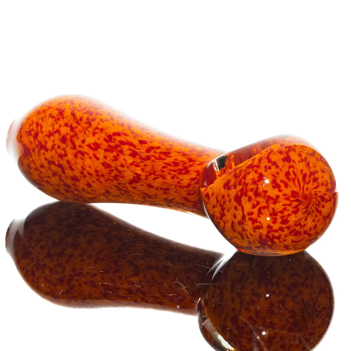 Orange and red frit glass hand pipe with reflective surface, spoon style design