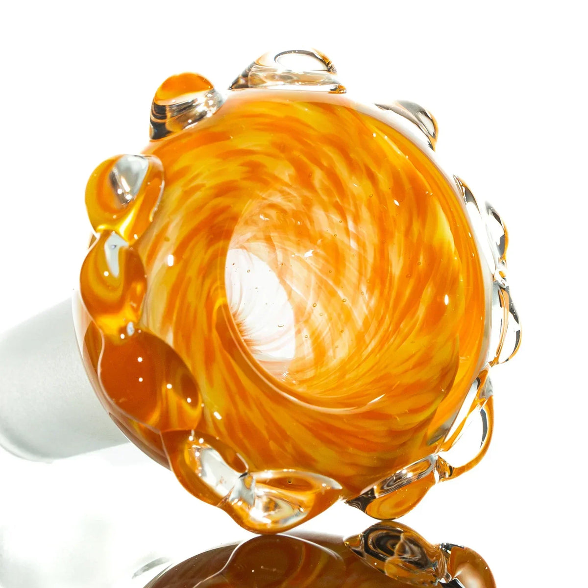 Orange and yellow 14mm glass bowl slide with clear marble accents, close-up view