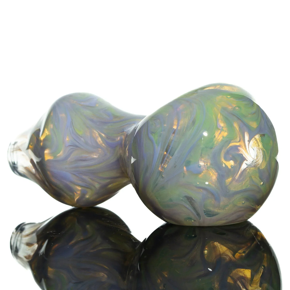 Colorful hand-blown glass spoon pipe with pink and green swirl design on reflective surface