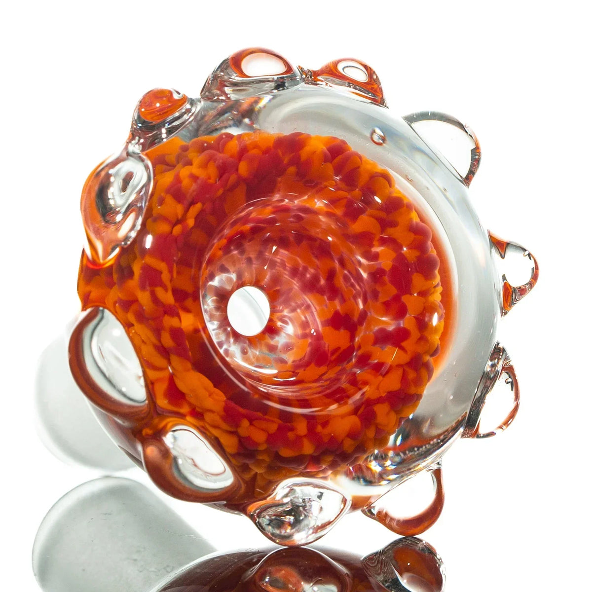 Red and orange 14mm glass bowl slide with frit and clear glass accents on white background
