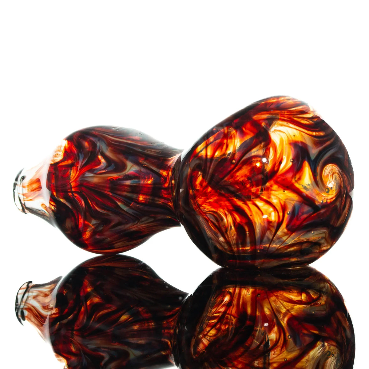 Red and orange glass spoon pipe with swirled slyme wrap design on white background