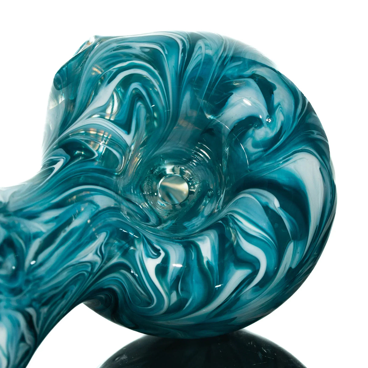 Teal and white glass hand pipe with hourglass shape and swirling patterns on white background