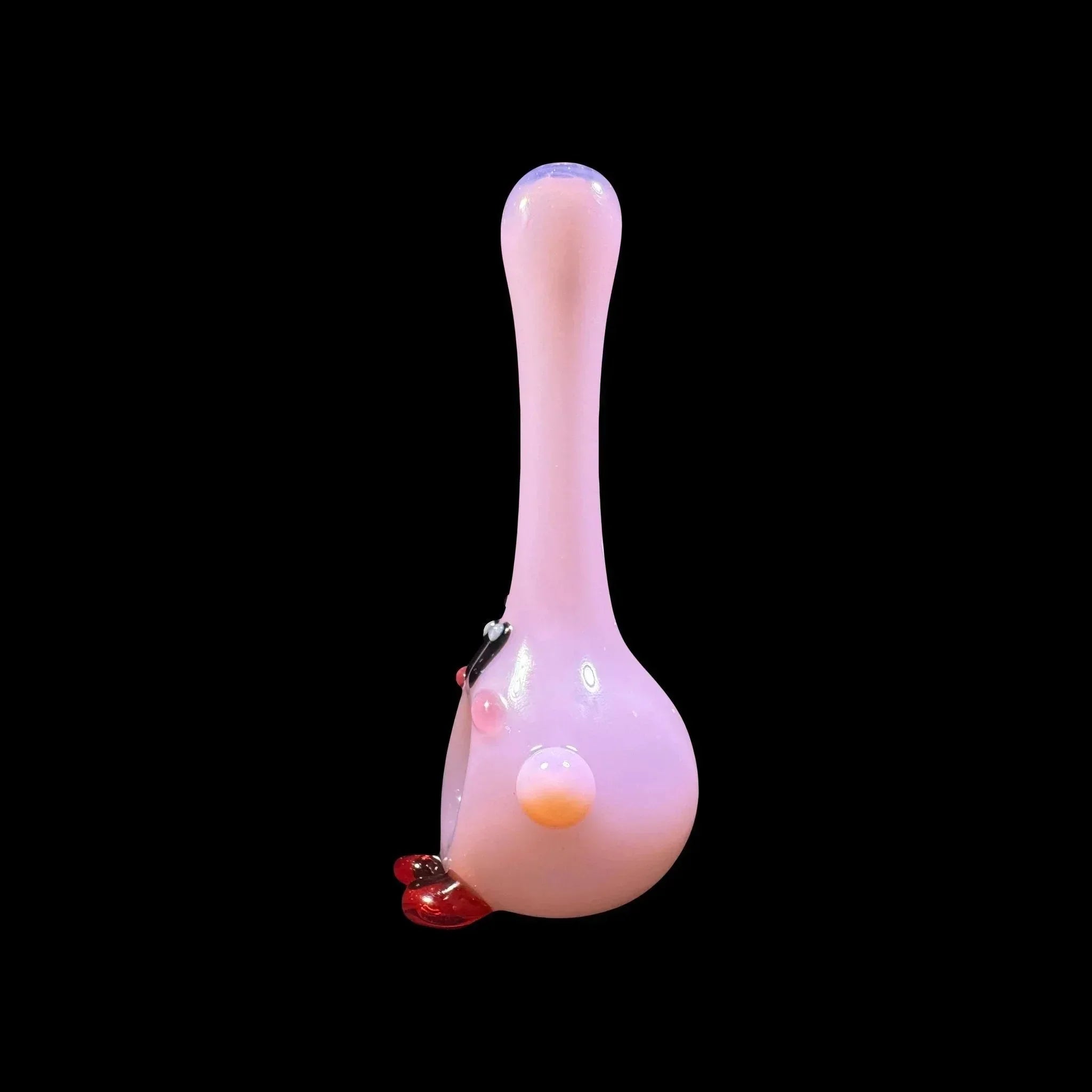 Pink glass hand pipe with red lips and playful decorative details on black background
