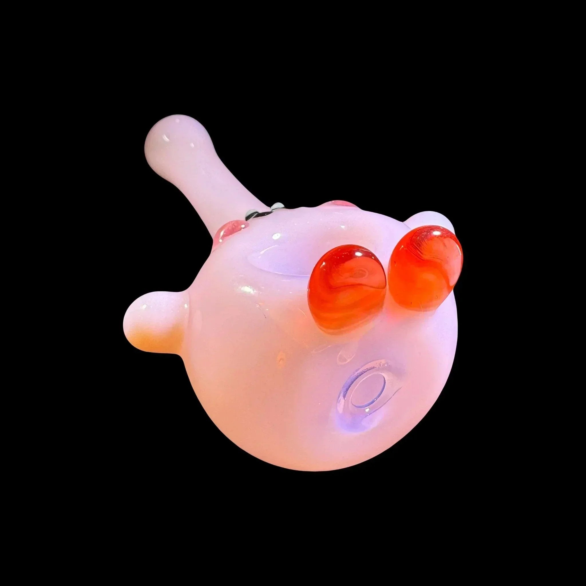 Pink glass hand pipe with red accents, unique artistic smoking accessory on black background