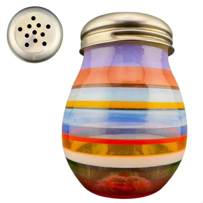 Colorful striped glass jar with metal lid, used for storing herbs or spices