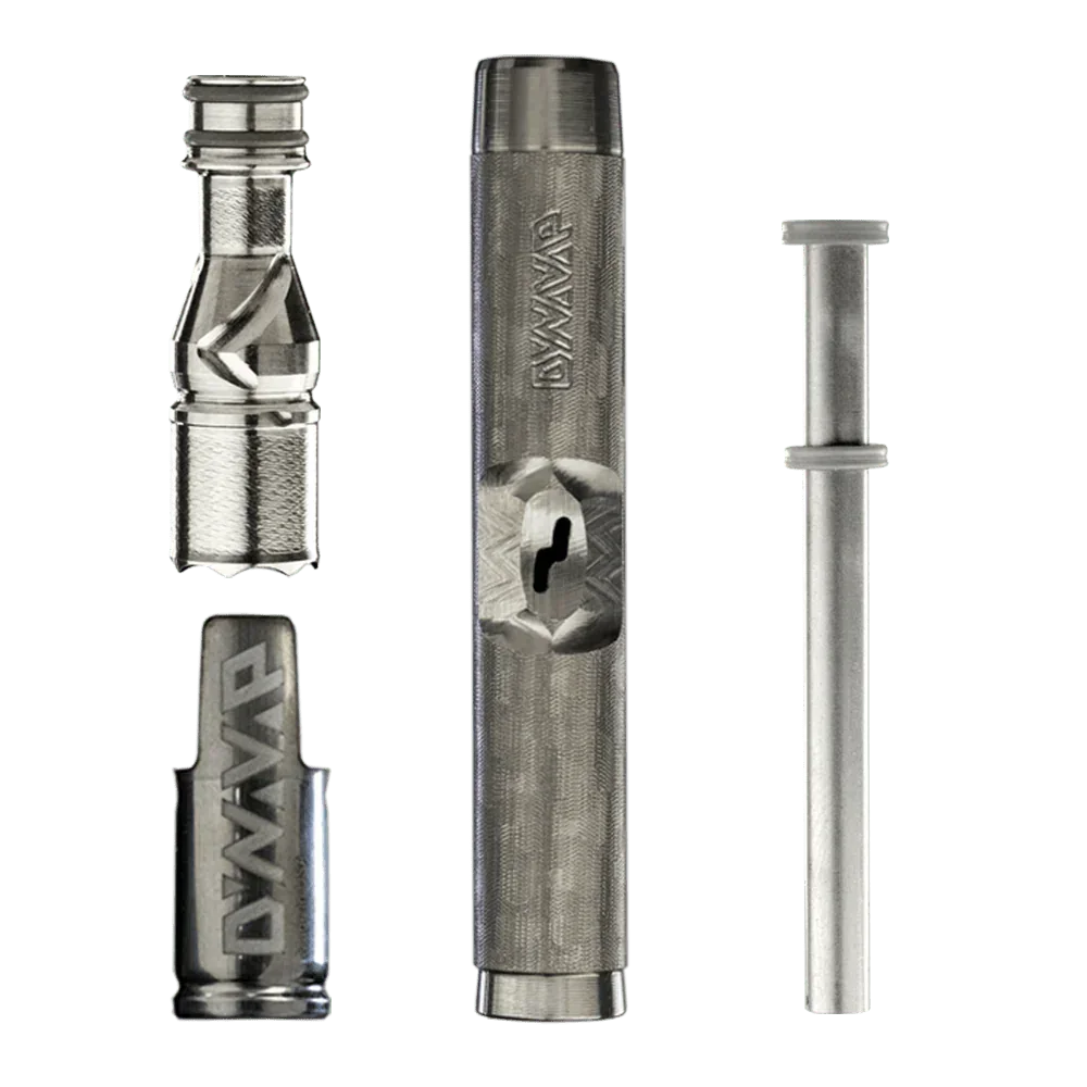Stainless steel vaporizer parts and accessories on a green background