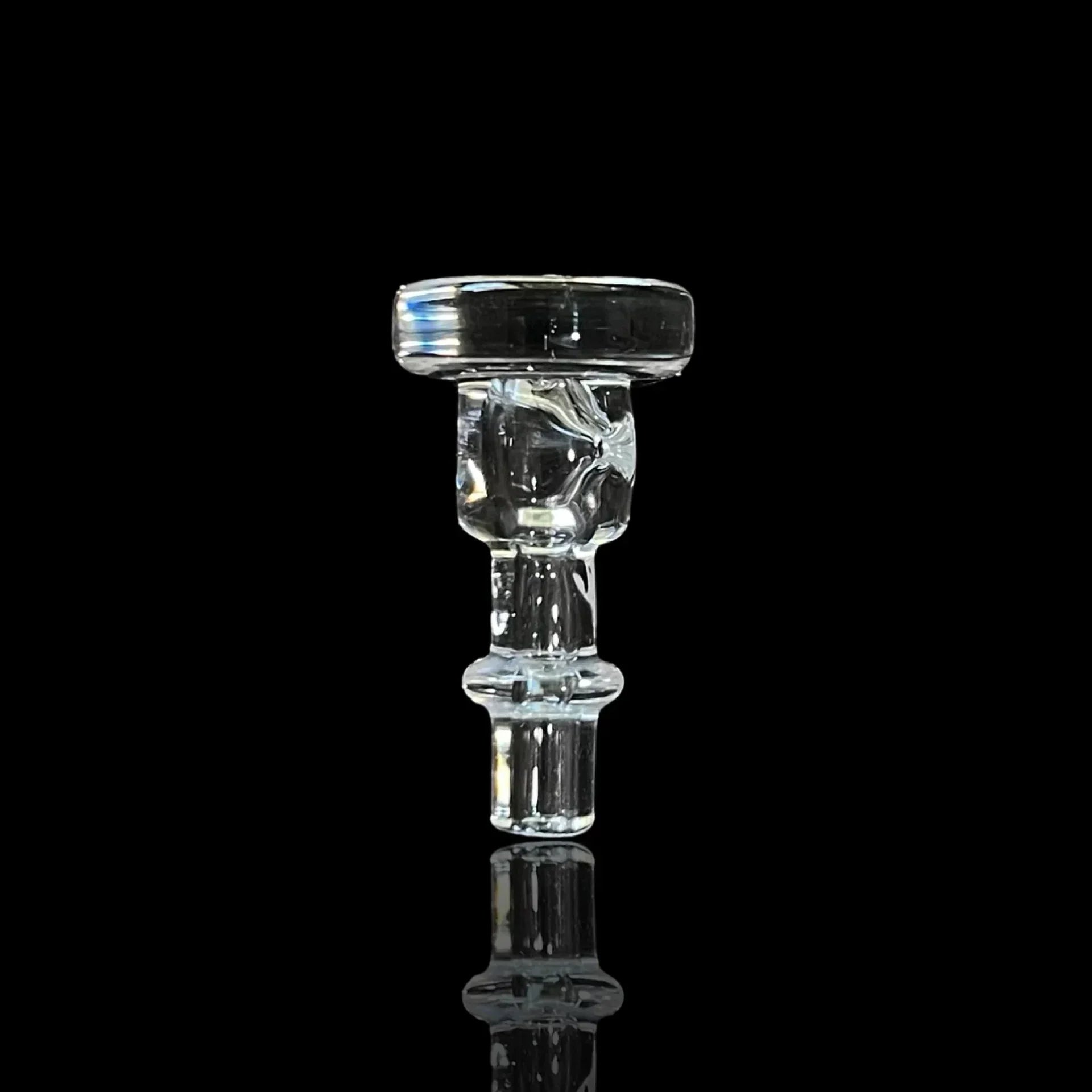 Clear glass bowl attachment for water pipe on black background, heady glass accessory