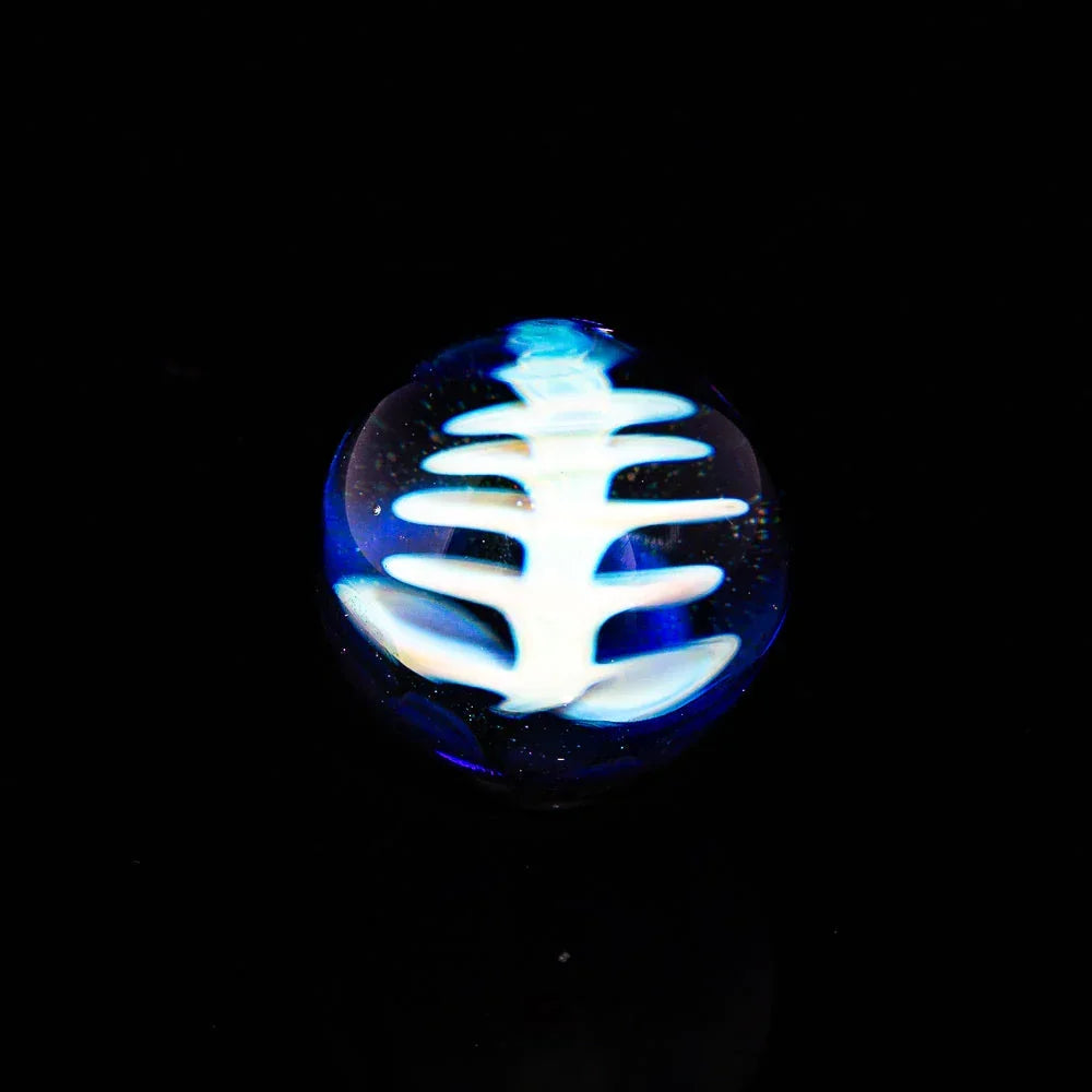 Heady glass carb cap with glowing white fishbone design on black background