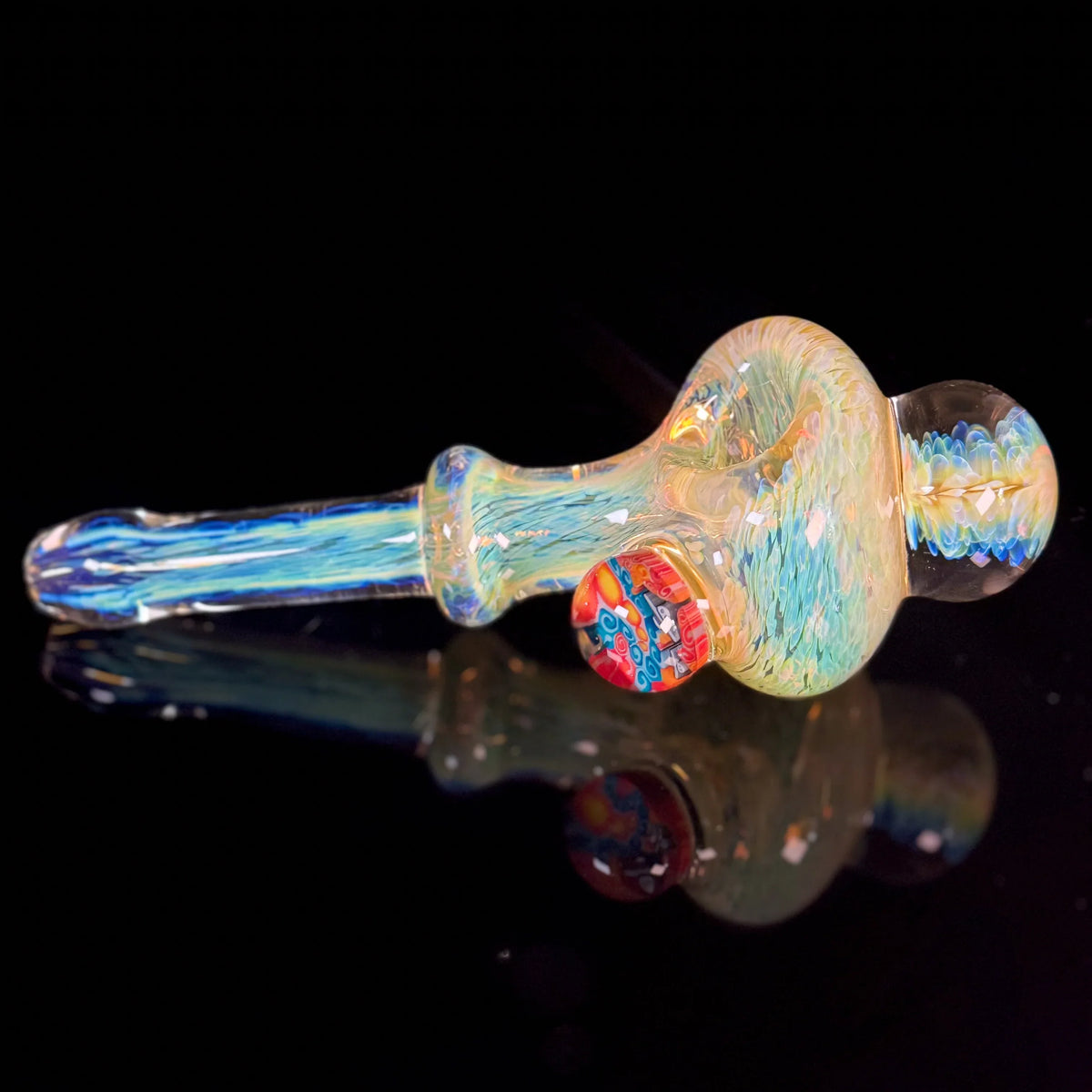 Handcrafted iridescent glass pipe with colorful marble accent on black background