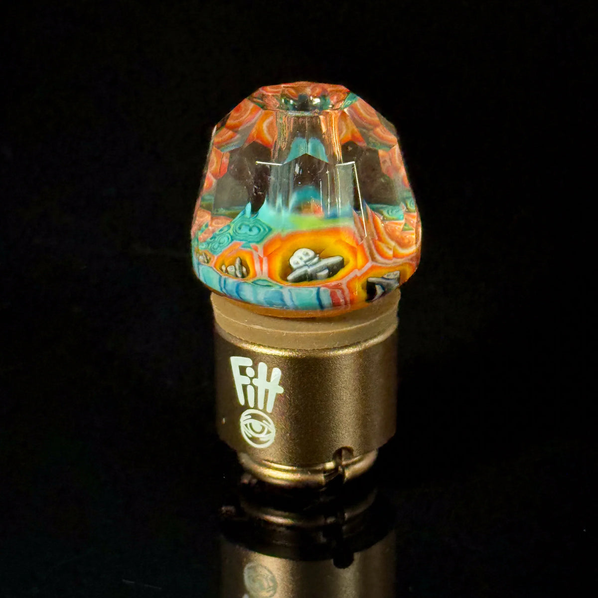 Colorful heady glass carb cap with intricate patterns, displayed on black background