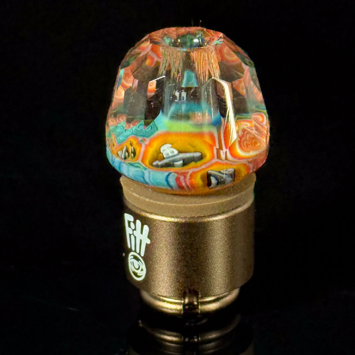 Colorful heady glass carb cap with intricate patterns for vaporizers on black background