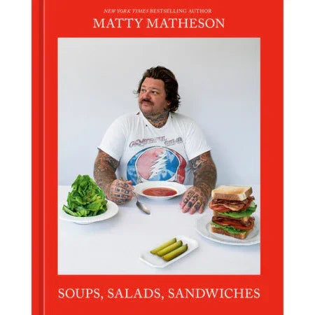 Cookbook cover featuring Matty Matheson with soup, salad, sandwich, and pickles on a table.