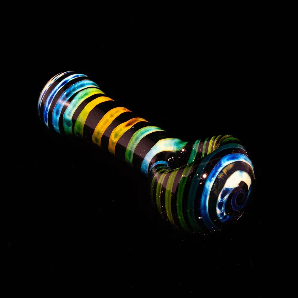Black fumed glass spoon pipe with colorful coil pattern on a black background