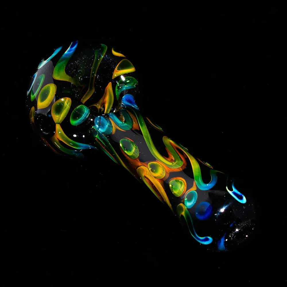 Black glass hand pipe with colorful swirl and flame patterns on a dark background