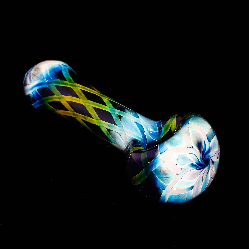 Hand-blown glass spoon pipe with blue crosshatch pattern and colorful swirl design