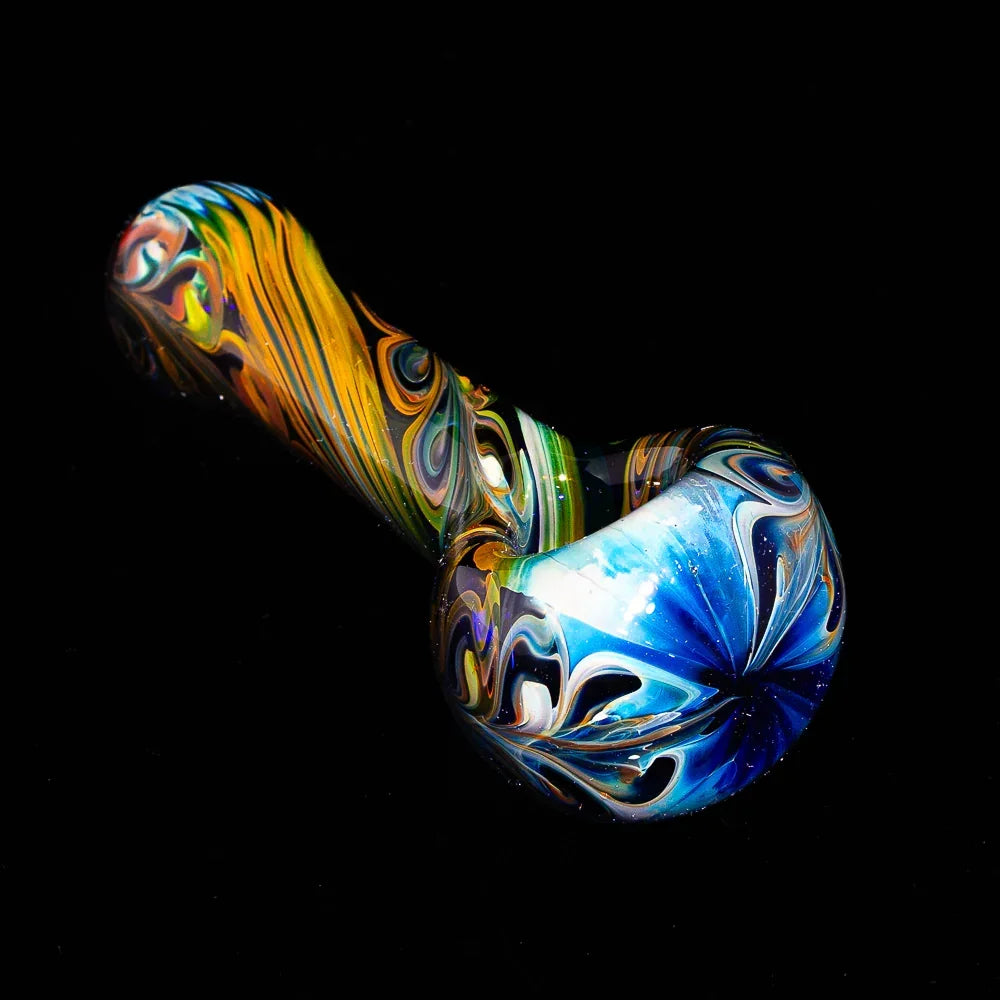 Blue paisley linework glass spoon pipe with vibrant swirl patterns on black background