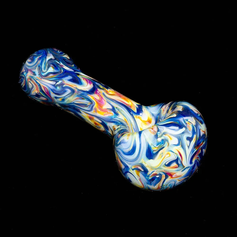Blue and yellow marble glass hand pipe with swirling patterns on black background