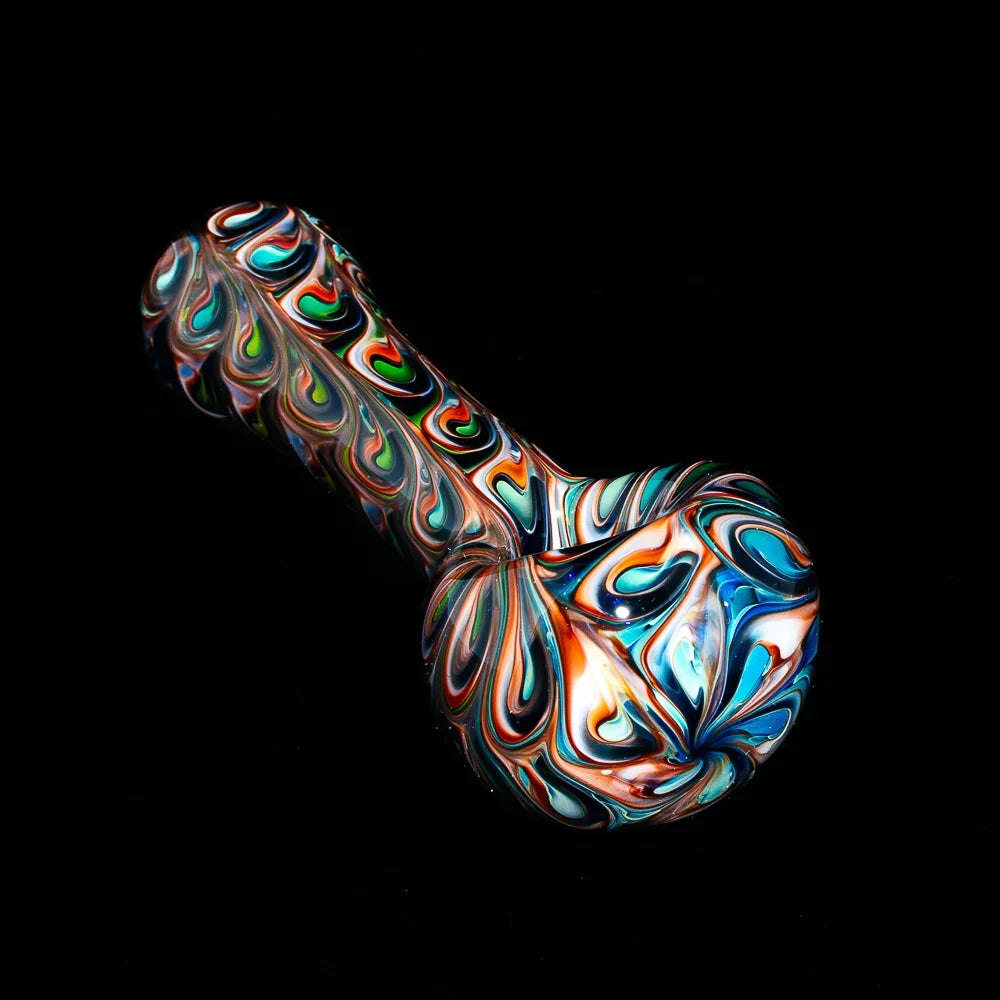 Colorful hand-blown glass spoon pipe with vibrant peacock feather swirl design