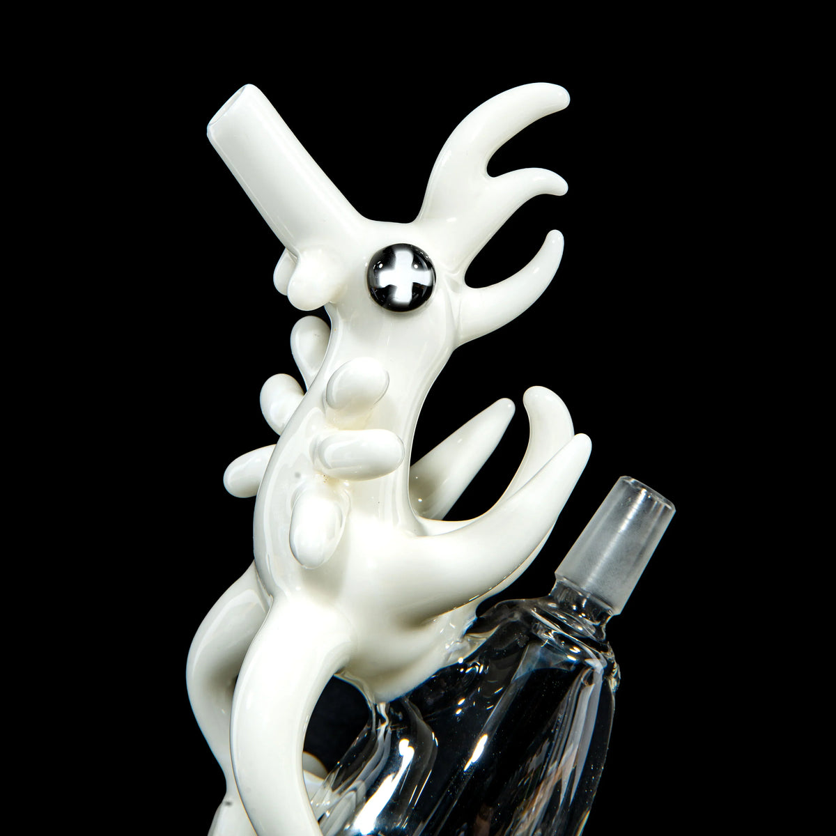 Intricate black and white heady glass pipe with abstract creature design and clear glass base