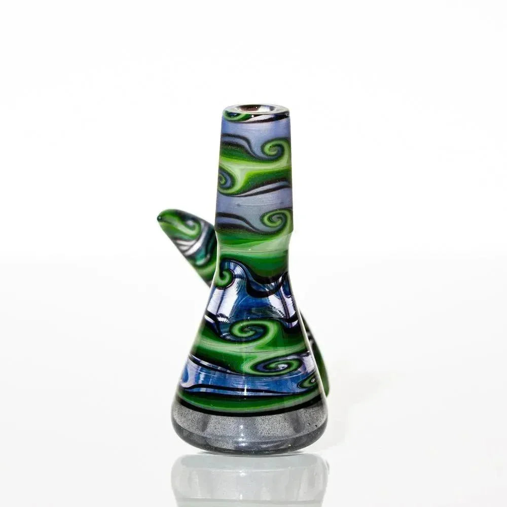 Colorful 14mm glass slide with green, blue, and black swirl patterns on a white background