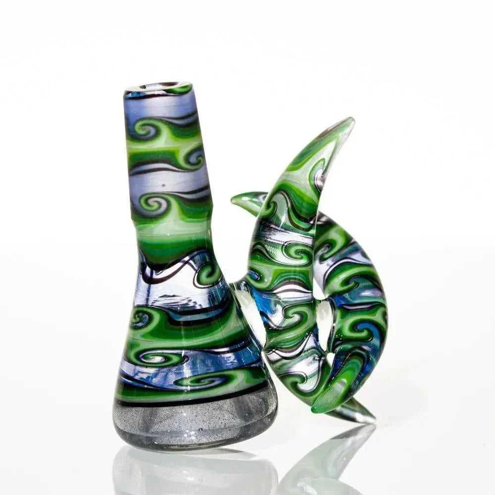 Hand-blown glass slide with green, blue, and white swirls and a crescent-shaped handle.