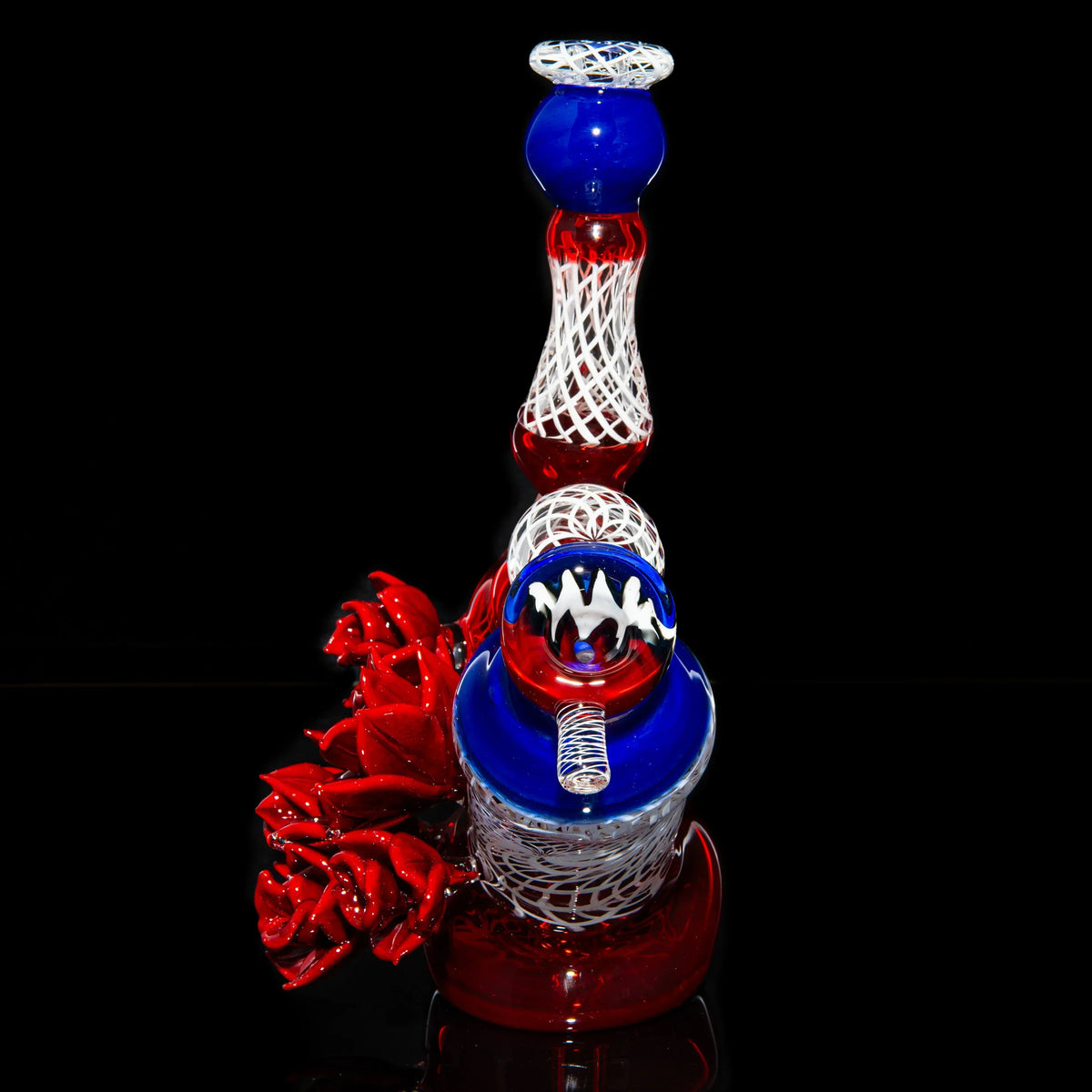 Artistic red, white, and blue glass water pipe with intricate patterns and rose details