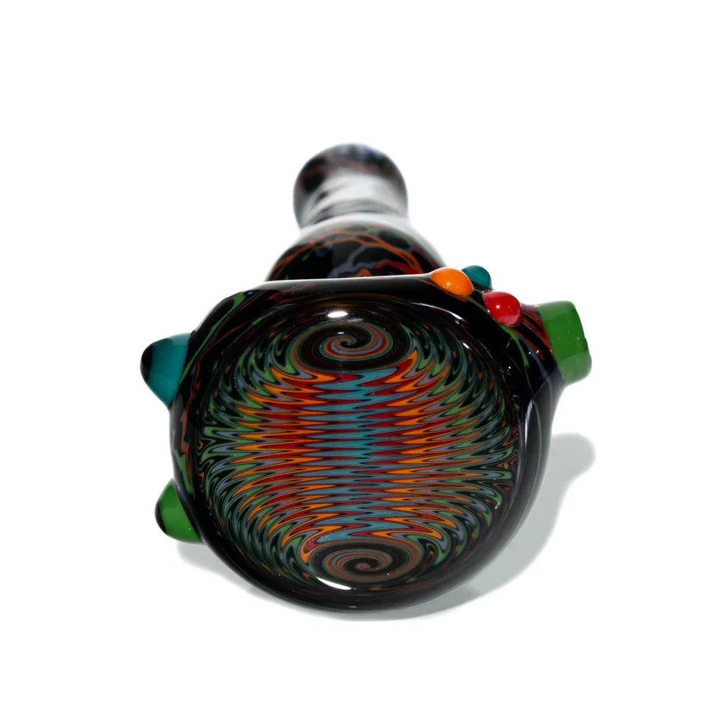 Handblown glass spoon pipe with black wig wag pattern and colorful marble accents