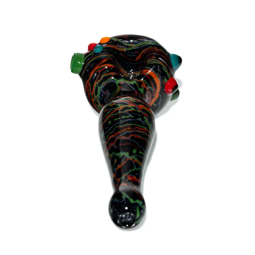 Colorful hand-blown glass spoon pipe with black, orange, green, and red wig wag patterns.