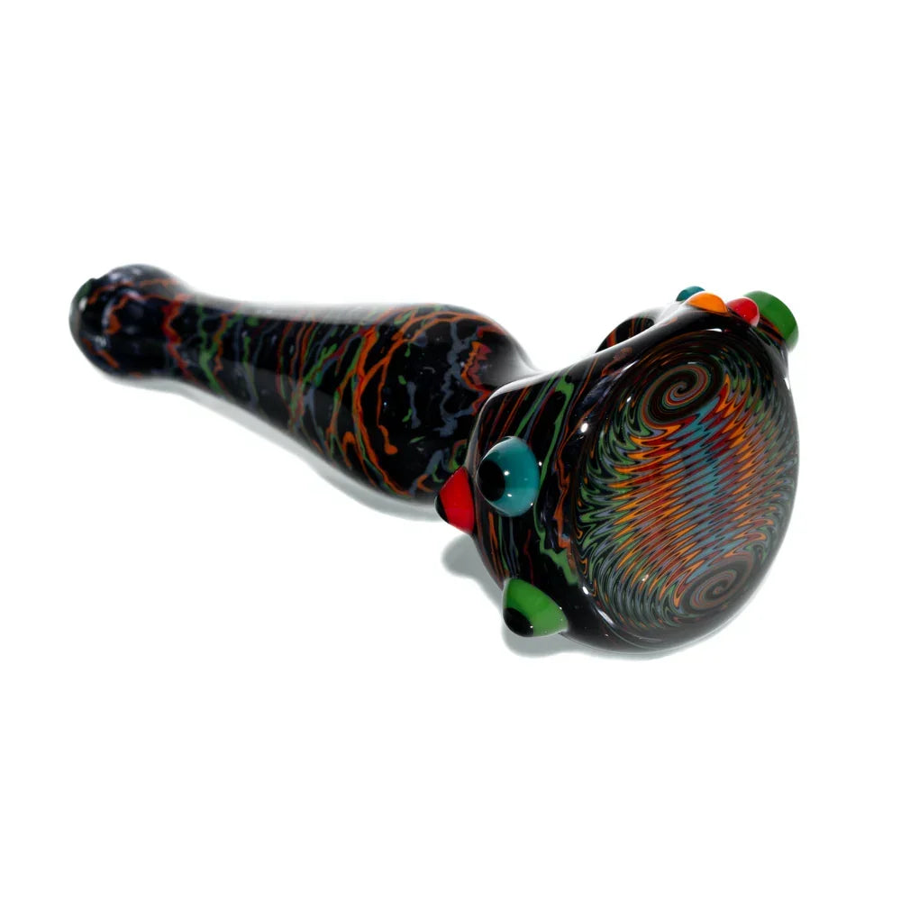 Heady glass spoon pipe with vibrant black, orange, and rainbow wig wag design