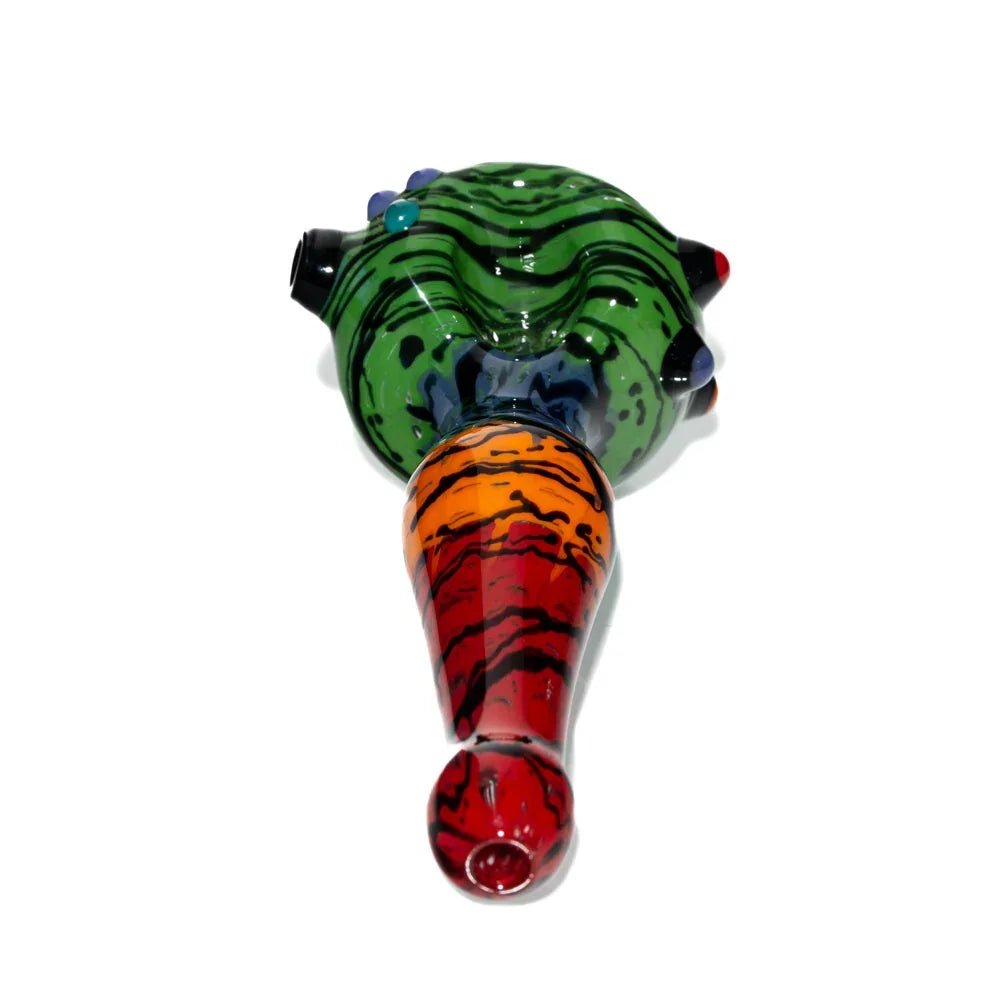 Colorful hand-blown glass spoon pipe with green, red, and orange wigwag patterns