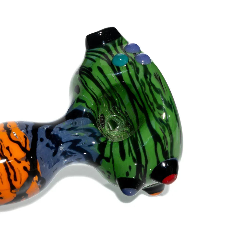 Green rainbow wig wag glass spoon pipe with colorful accents on a white background