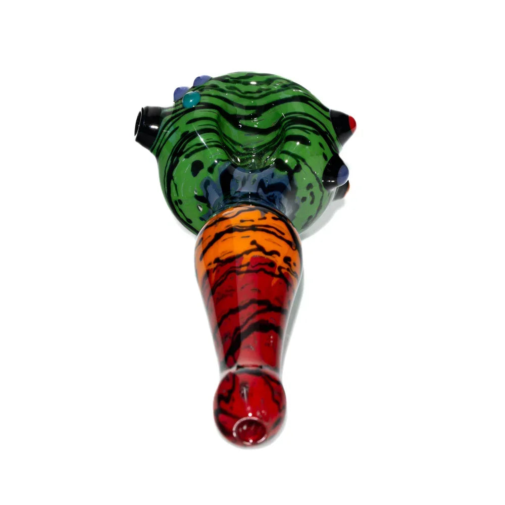 Colorful glass hand pipe with green and rainbow wig wag design on white background
