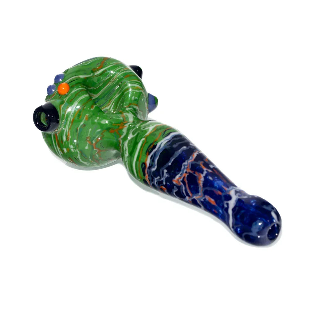 Hand-blown glass spoon pipe with green and navy wigwag design on white background