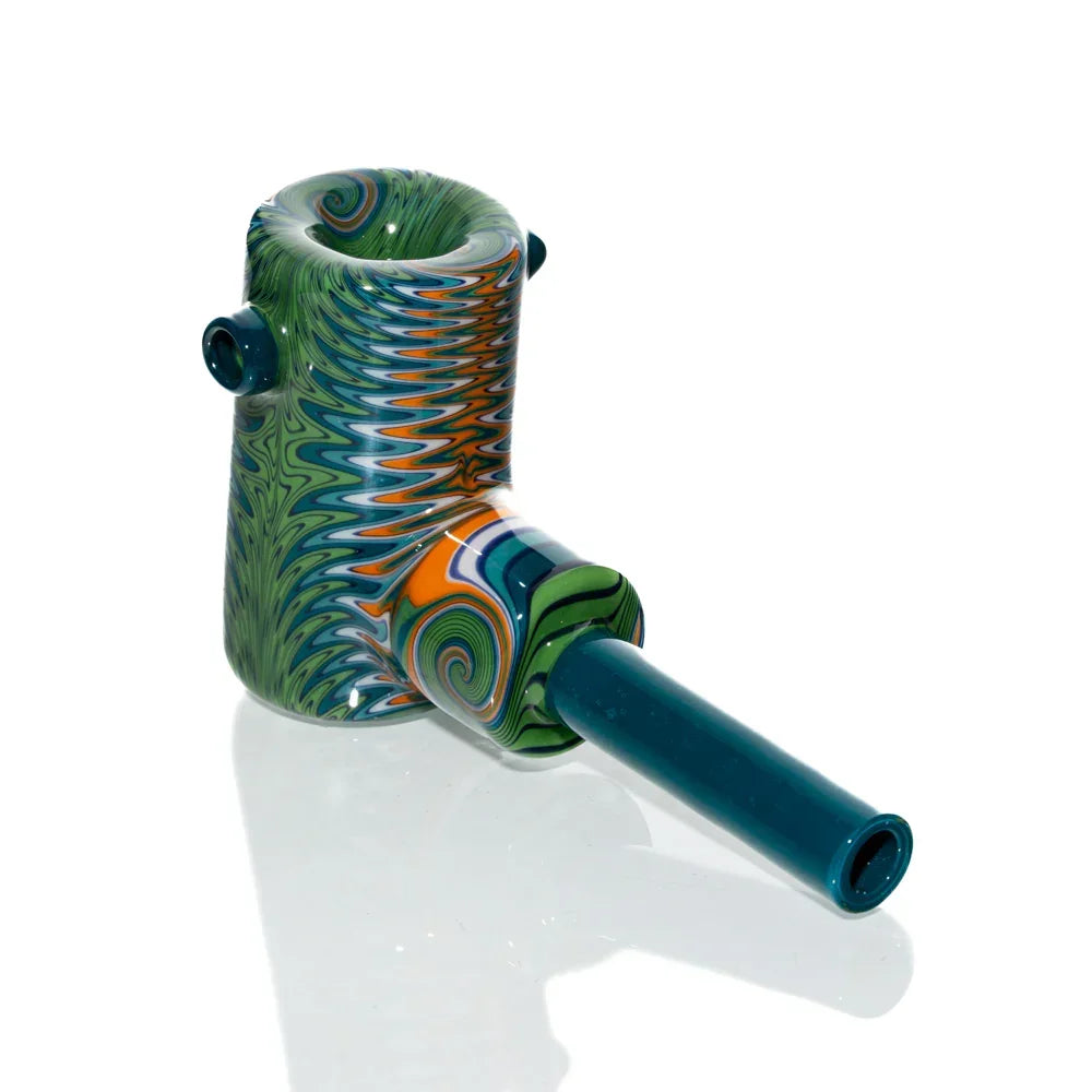 Colorful teal and green wig wag glass hand pipe with intricate swirl patterns