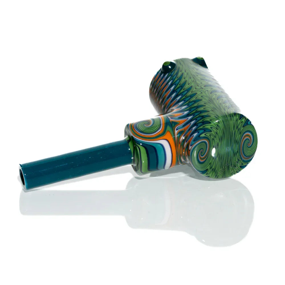 Colorful teal and green wig wag patterned glass hand pipe with swirled corn cob design