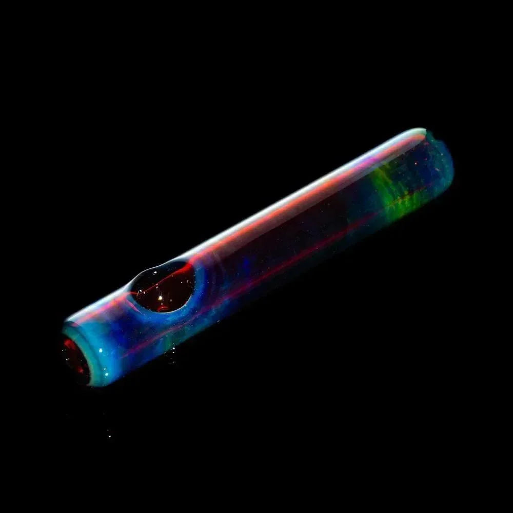 Colorful glass steamroller pipe with amber and blue hues on a black background