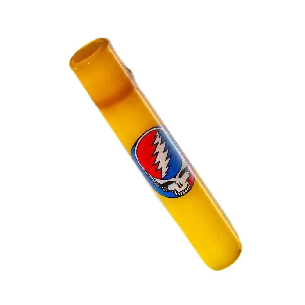 Amber glass chillum with colorful Stealie skull design, smoking accessory on white background