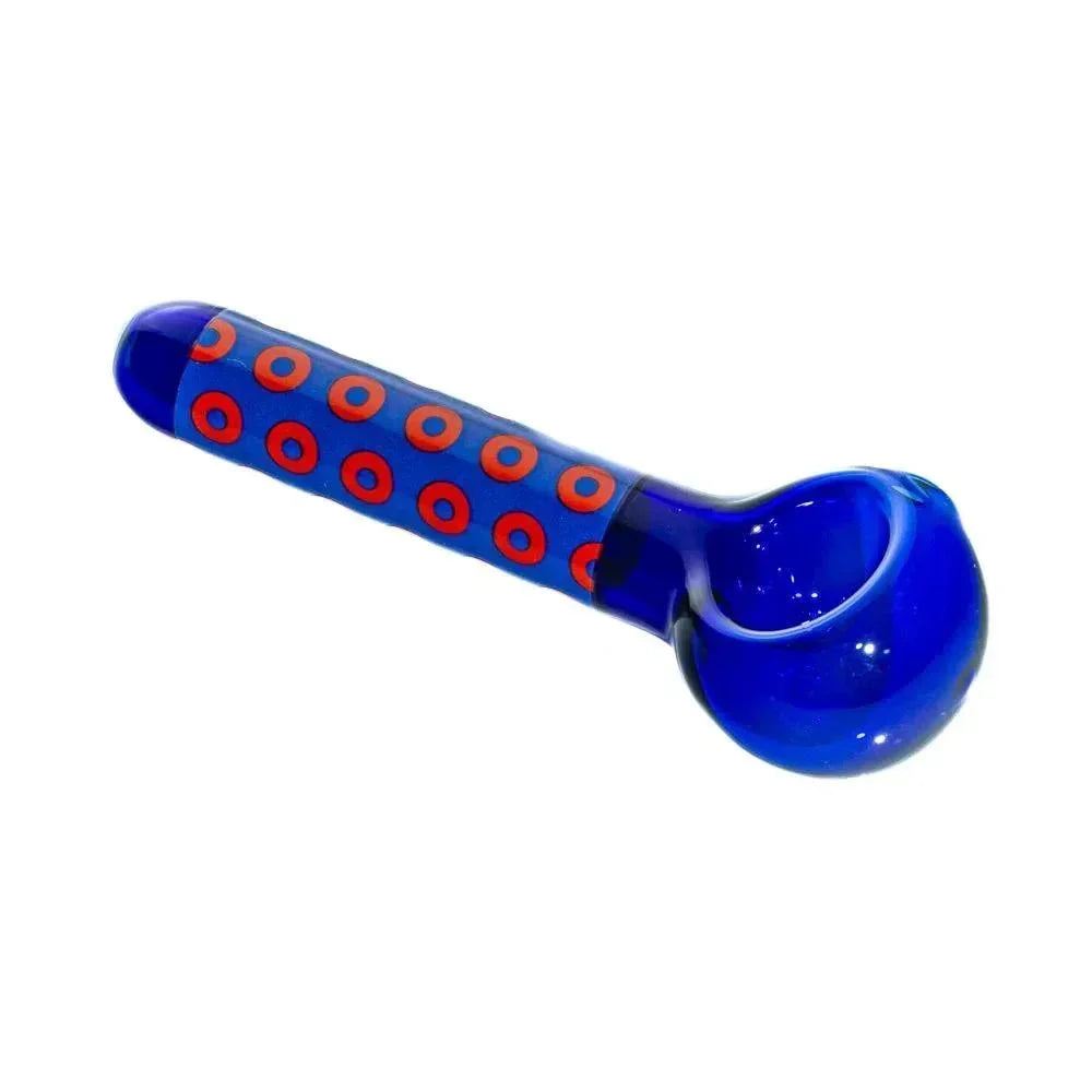 Cobalt blue glass hand pipe with red donut pattern on handle, isolated on white background