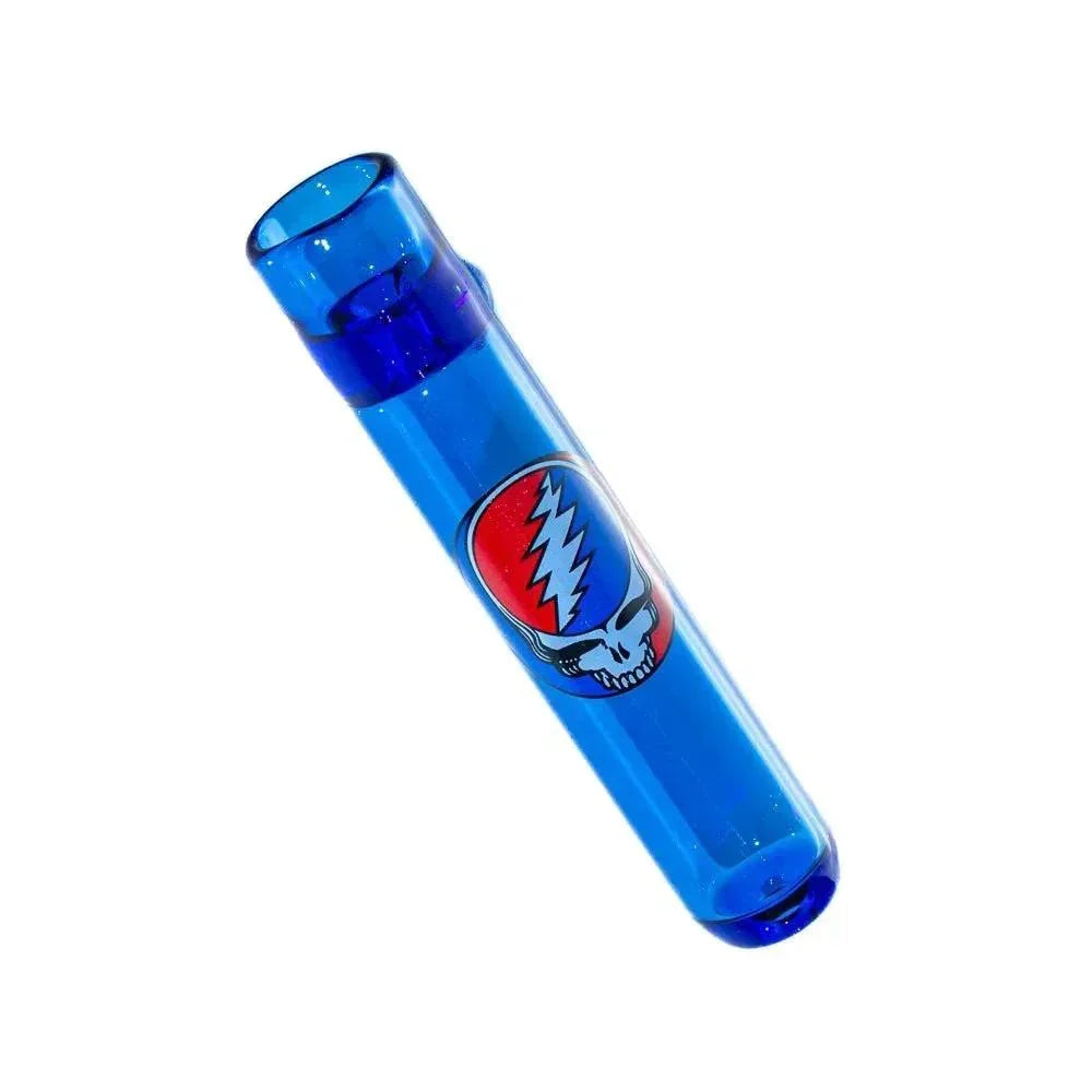 Cobalt blue glass chillum with colorful skull decal, isolated on white background