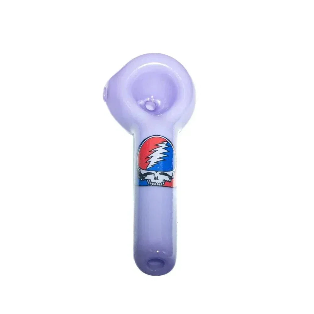 Milky purple glass spoon pipe with a red and blue lightning skull design on the handle.