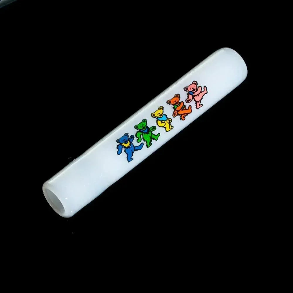 White glass chillum with colorful dancing bears artwork on a black background