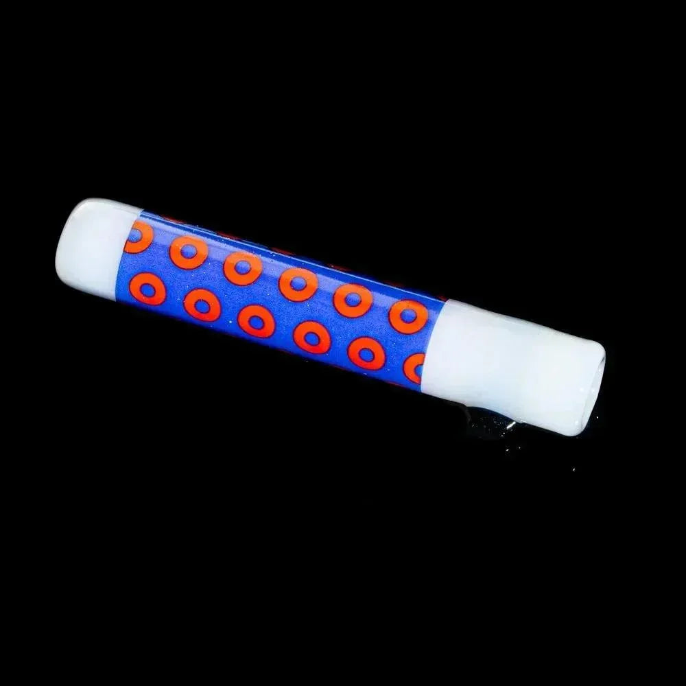 Colorful glass chillum pipe with white ends and blue body featuring red donut patterns