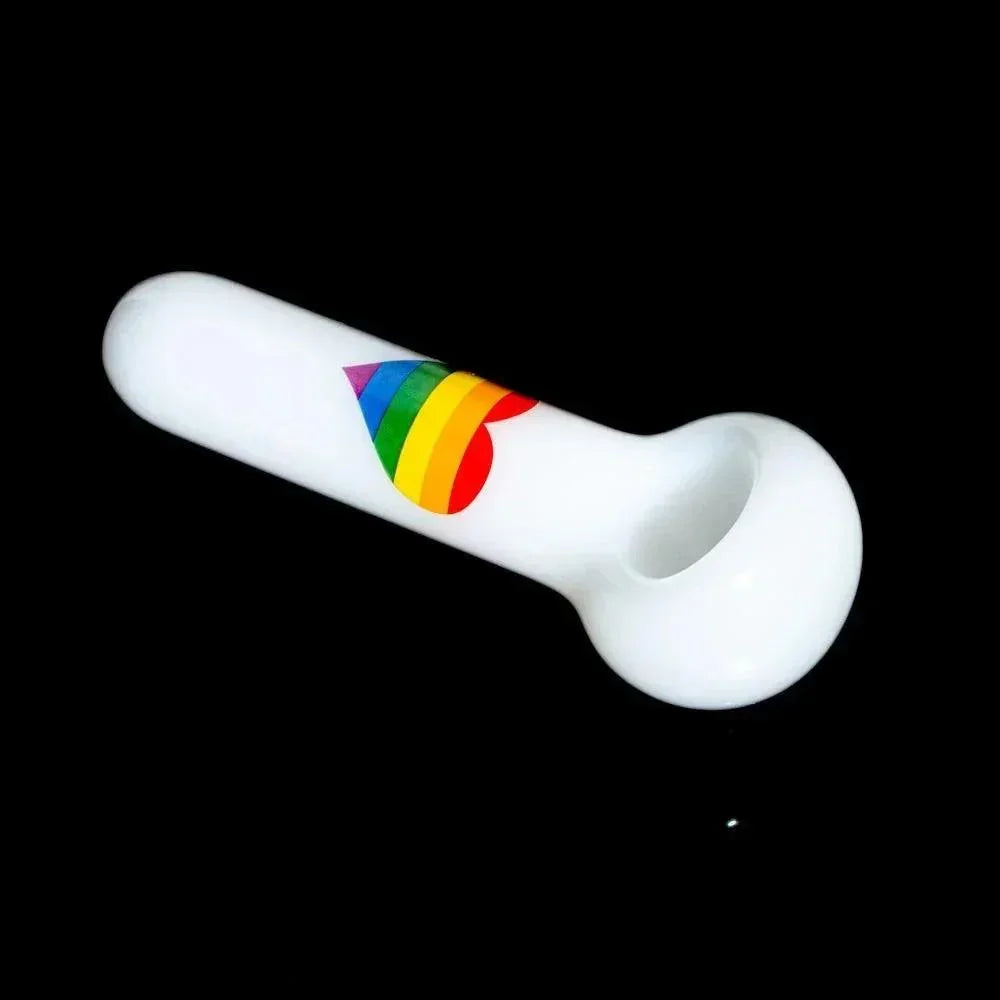 White glass pipe with rainbow heart design on black background